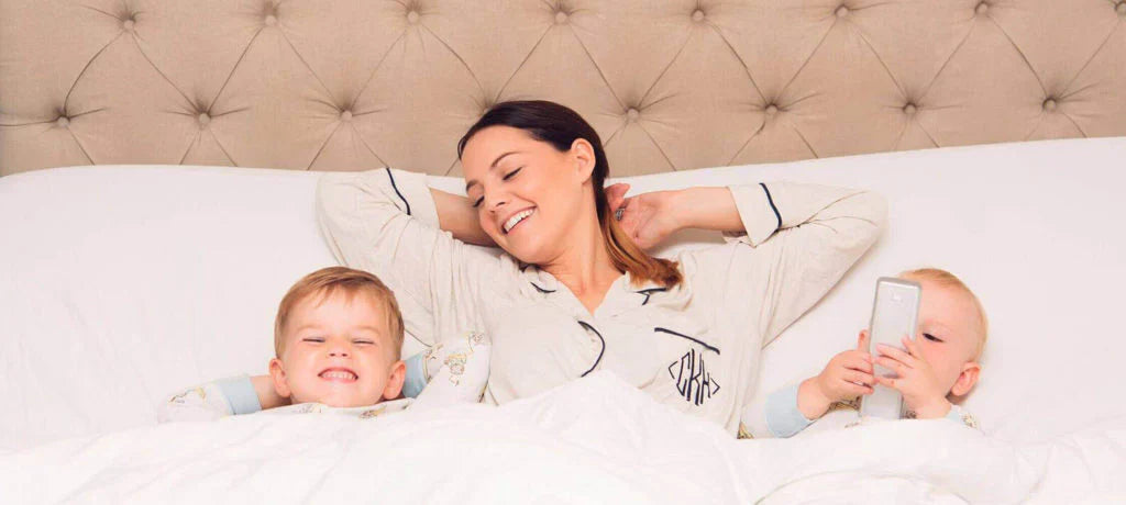 Mom and kids laying on a Serta mattress