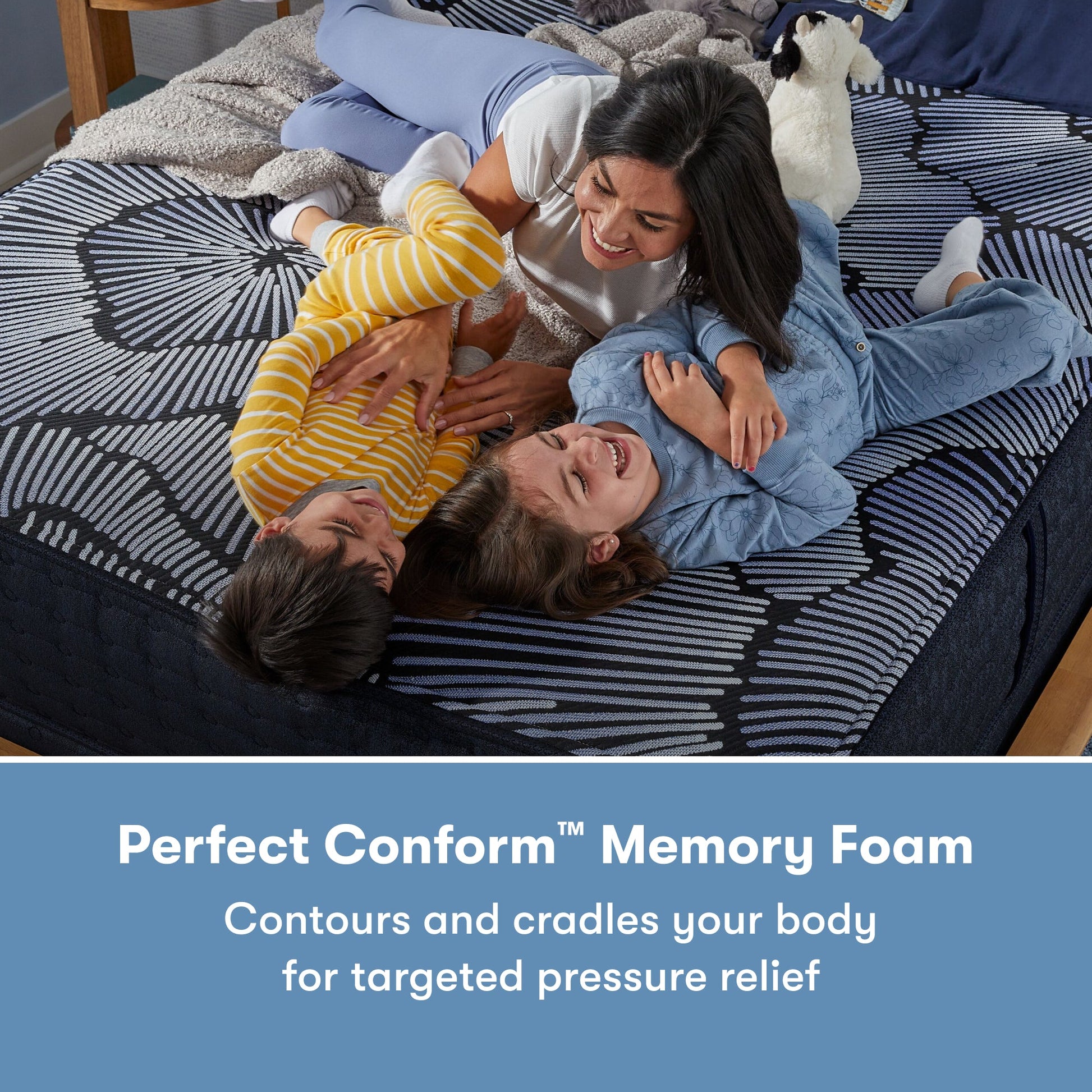 Family of 3 laying on a Perfect Sleeper X Hybrid Aspen Firm Mattress || feel: firm || level: Level 1