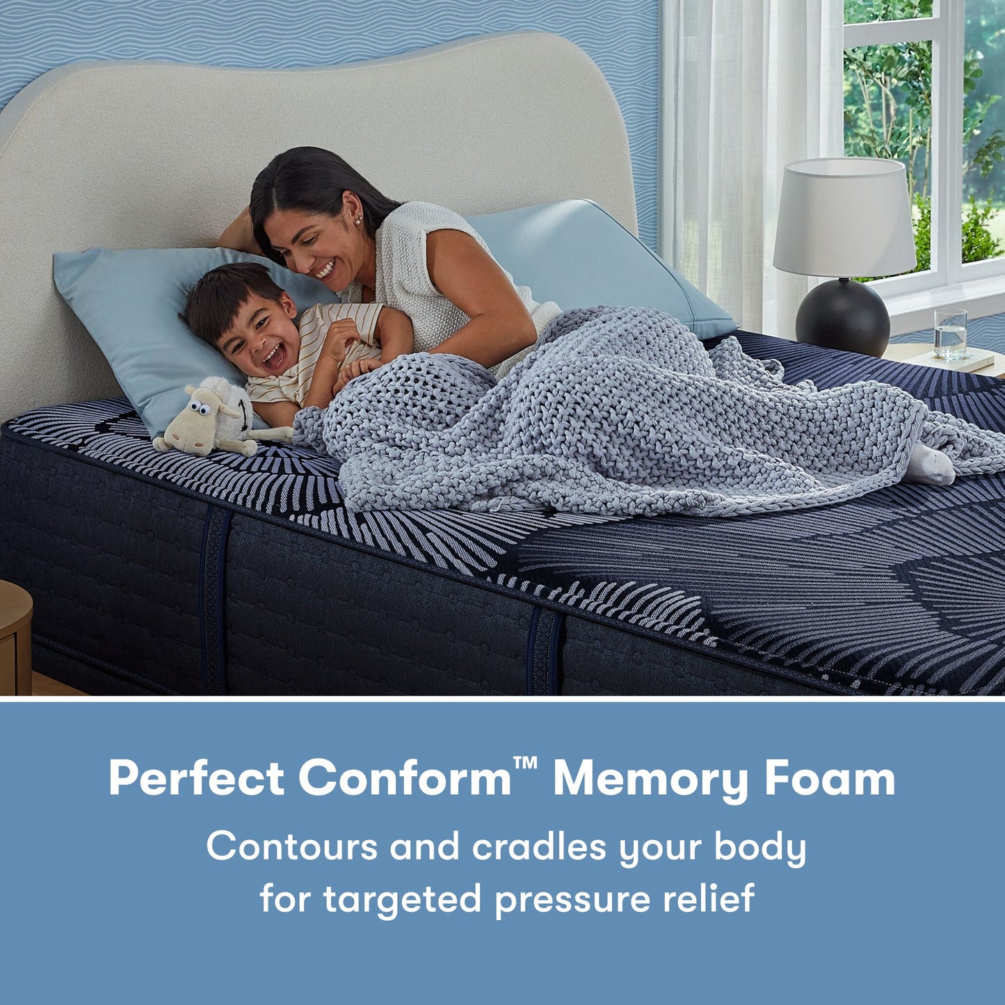 Woman laying with her son on a Perfect Sleeper X Hybrid Prescot Medium Firm Mattress || feel: Medium Firm || level: Level 2