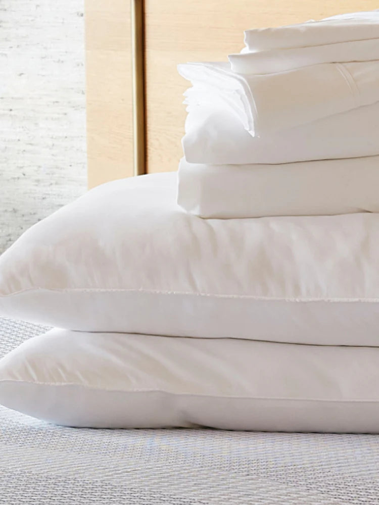 Close up image of the Serta mattress bundle bedding stacked on one another