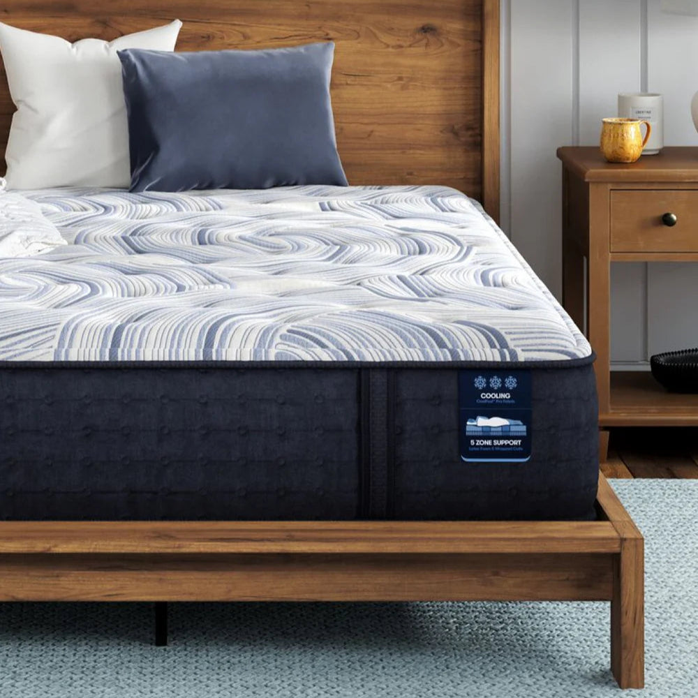 Close up corner shot of Serta Perfect Sleeper mattress on a wooden bed