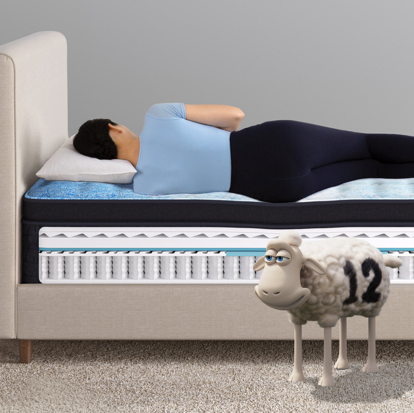 Woman sleeping on an innerspring mattress with a side cutout revealing its layered construction of coils and foam, while a Serta sheep sleeps on the floor. The mattress topper is quilted.