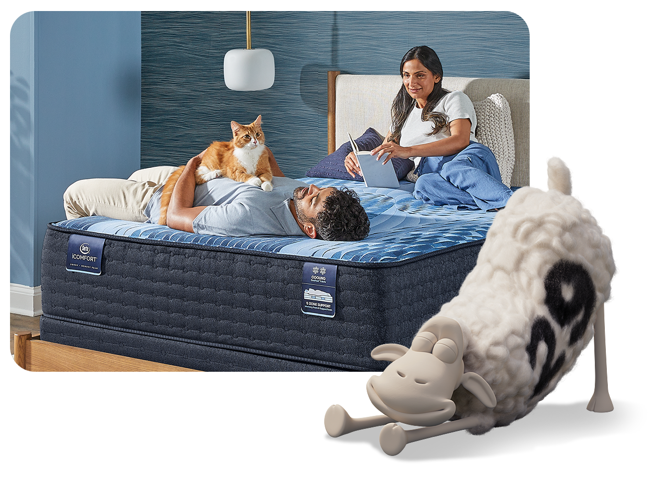 Man laying on mattress holding his cat while his wife reads a book