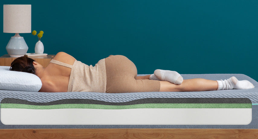 Woman sleeping on comfortable mattress