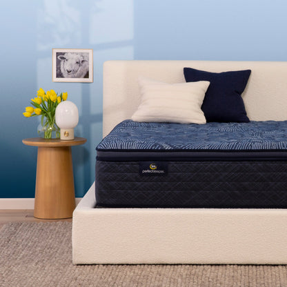 Serta Perfect Sleeper firm pillow top mattress in bedroom on beige bed||feel: firm pillow top||level: ultimate