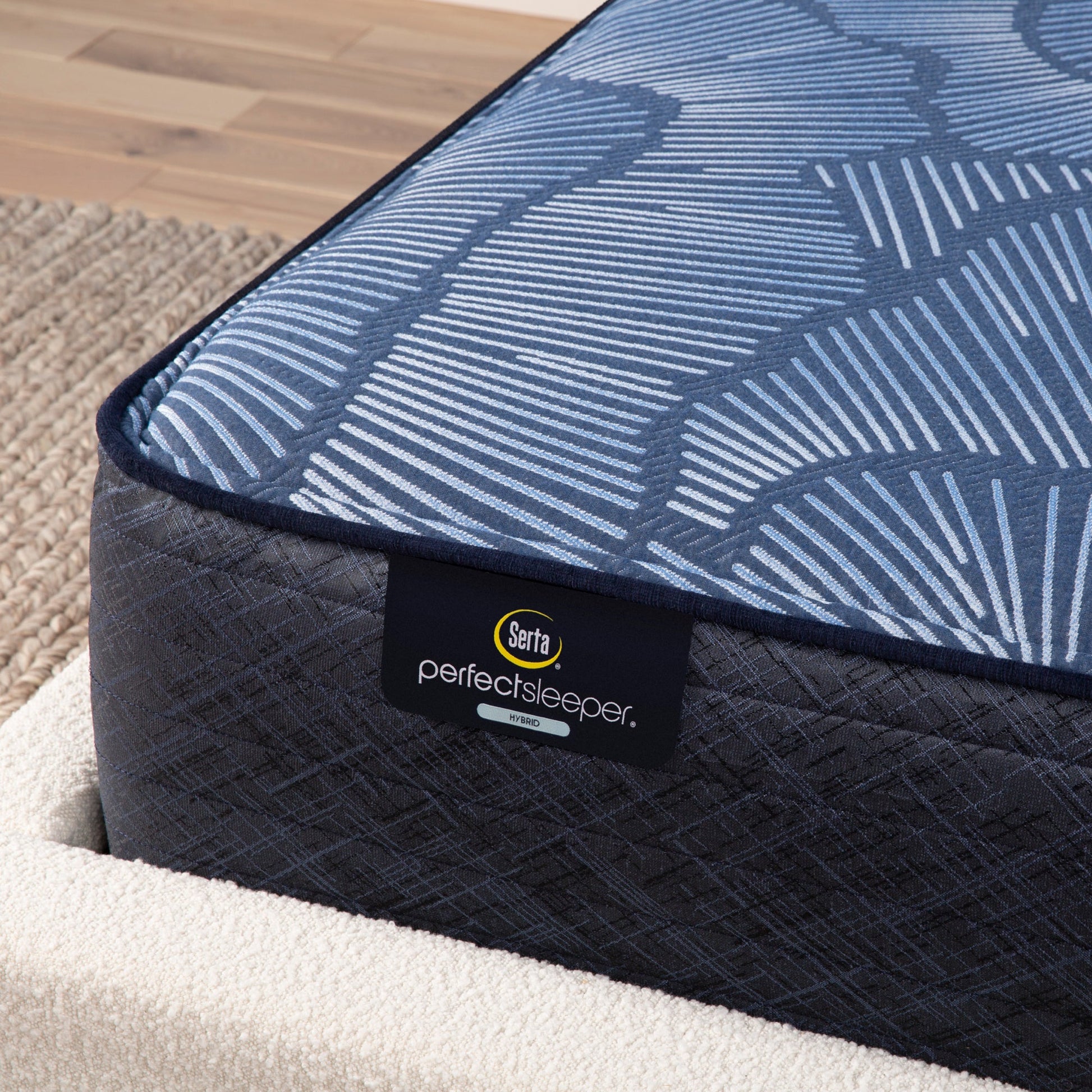 Corner view of Serta Perfect Sleeper hybrid firm mattress||feel: firm||level: standard