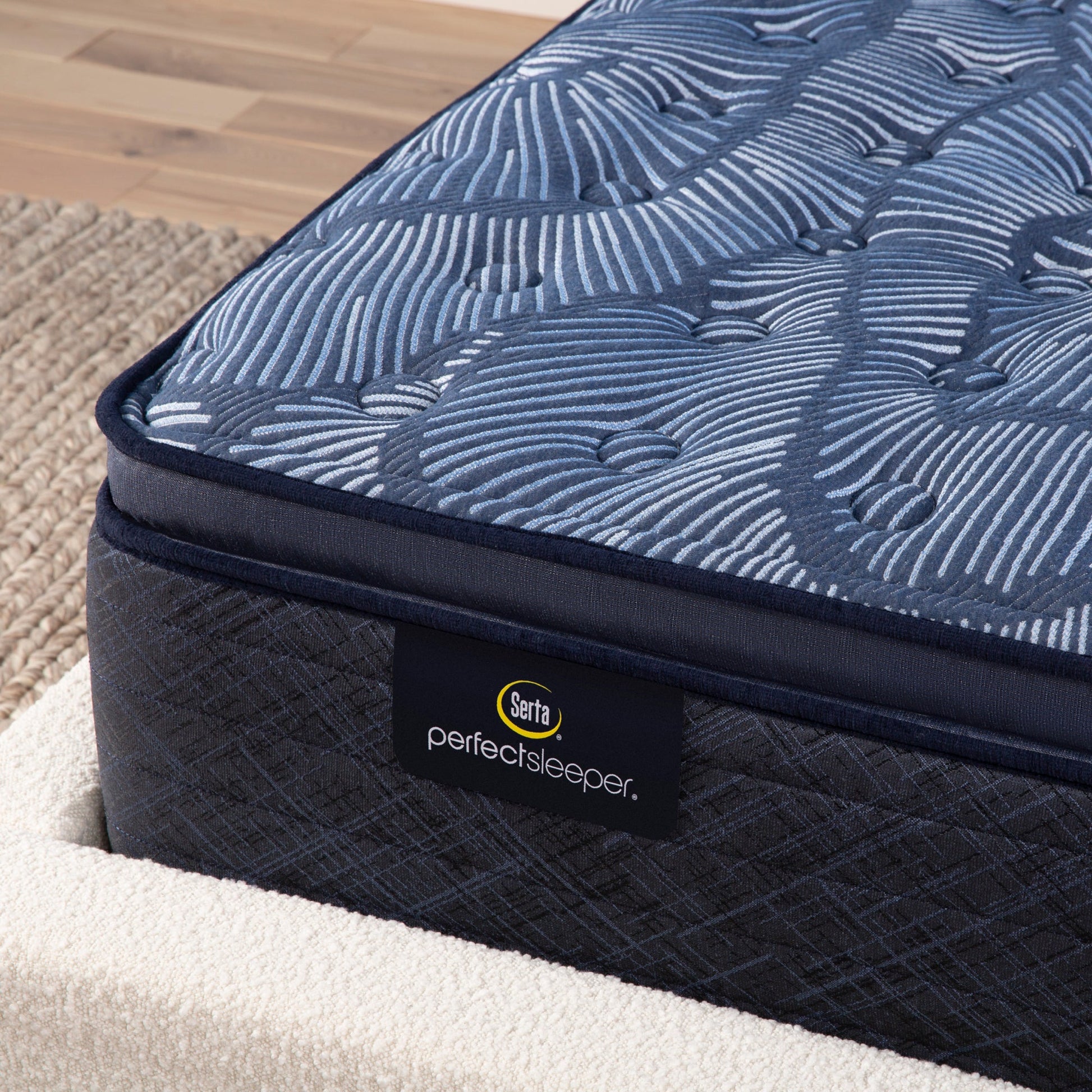 Corner detail of a Serta Perfect Sleeper medium pillow top mattress||feel: medium pillow top||level: ultimate