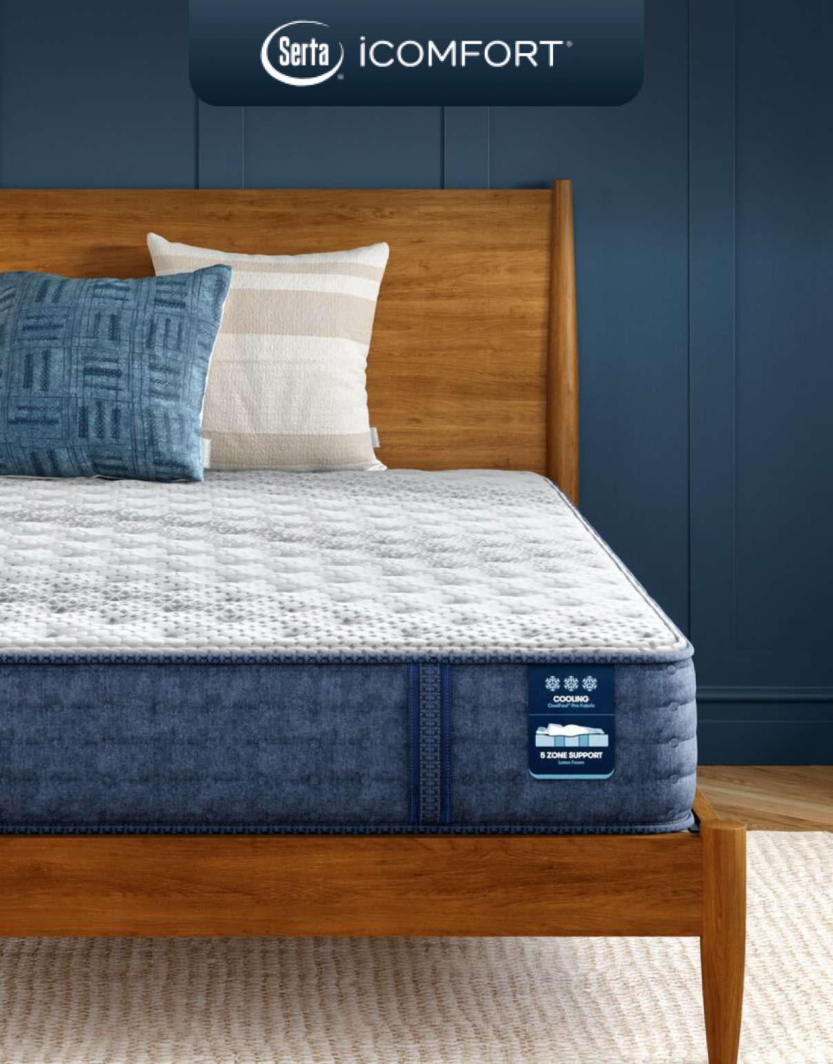 Serta iComfort mattress on a wooden bed, designed with 5 support zones, cooling foams, and cool-to-touch fabrics for full-body alignment and temperature regulation.