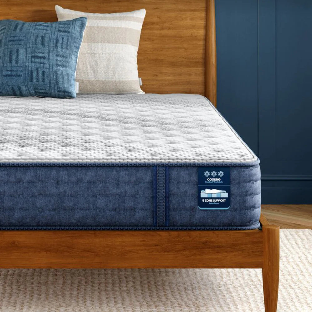 Serta iComfort mattress on a wooden bed, designed with 5 support zones, cooling foams, and cool-to-touch fabrics for full-body alignment and temperature regulation.