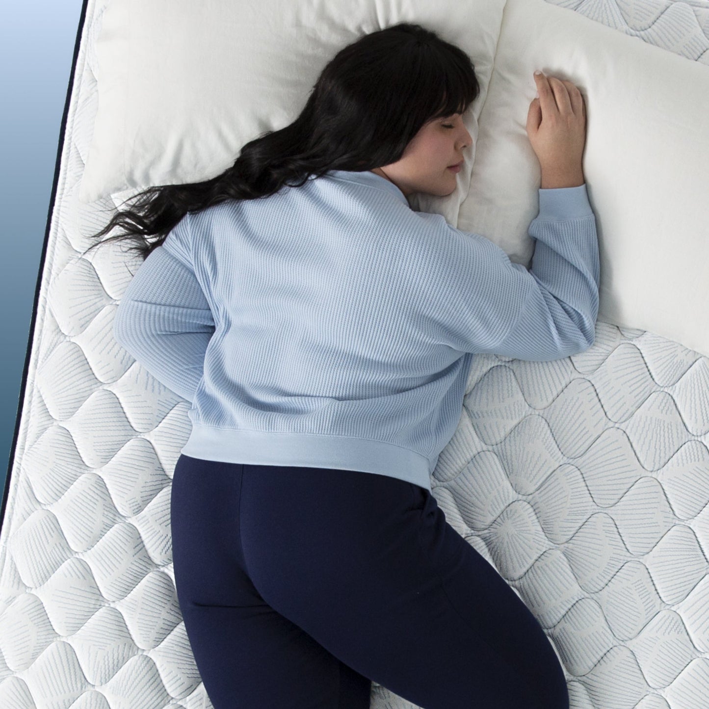 Woman sleeping on her stomach, on a Serta Perfect Sleeper mattress||level: standard