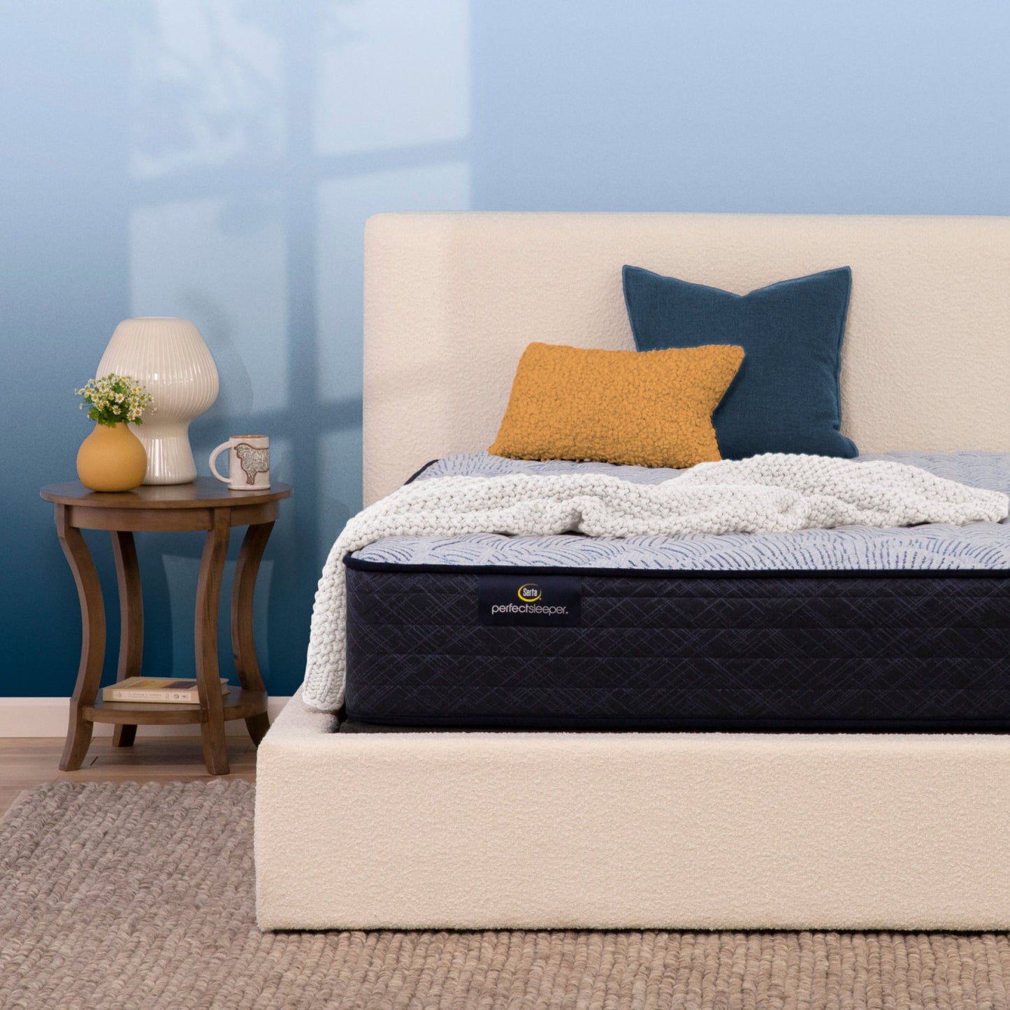 Serta Perfect Sleeper firm mattress in bedroom on beige bed||feel: firm||level: enhanced